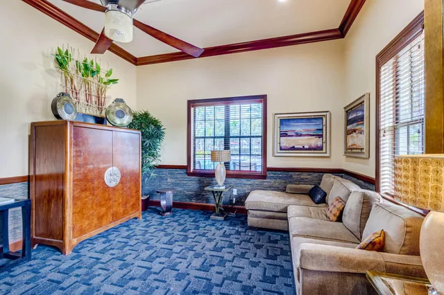 an aerial view of a house with garden space and swimming pool