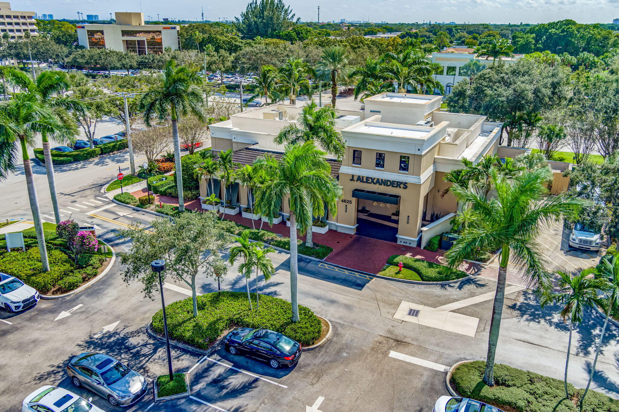 4903 Midtown Lane, Unit 3313 Palm Beach Gardens, FL 33418 - Photo 73 of 81 a view of a potted plants in front of a building