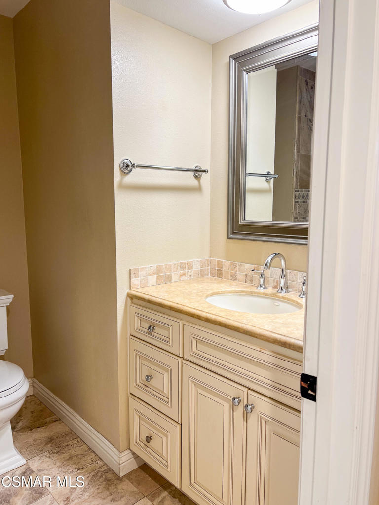 5458 Softwind Way Agoura Hills, CA 91301 - Photo 15 of 31 a bathroom with a sink and a toilet