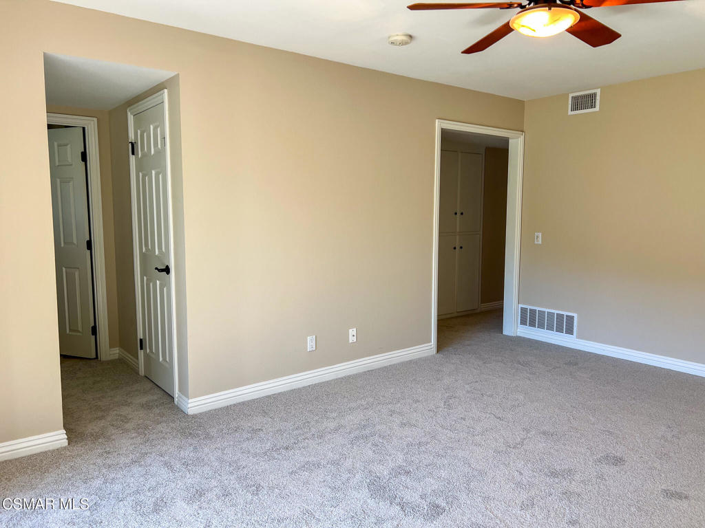 5458 Softwind Way Agoura Hills, CA 91301 - Photo 18 of 31 an empty room with a fan and a fan