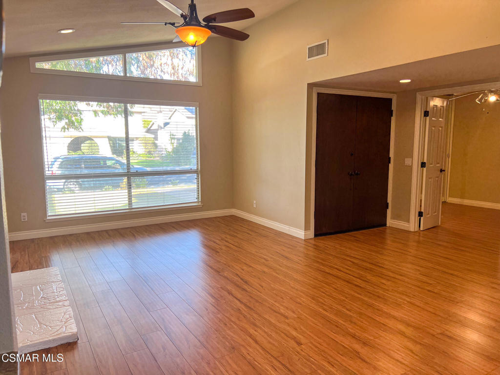 5458 Softwind Way Agoura Hills, CA 91301 - Photo 2 of 31 a view of an empty room with wooden floor and a window