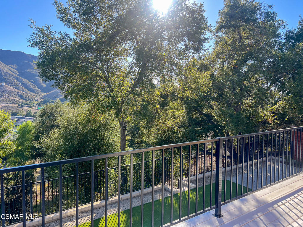 5458 Softwind Way Agoura Hills, CA 91301 - Photo 23 of 31 a view of a balcony with trees