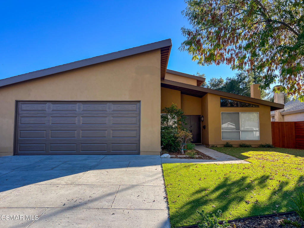 5458 Softwind Way Agoura Hills, CA 91301 - Photo 30 of 31 a view of a house with a yard