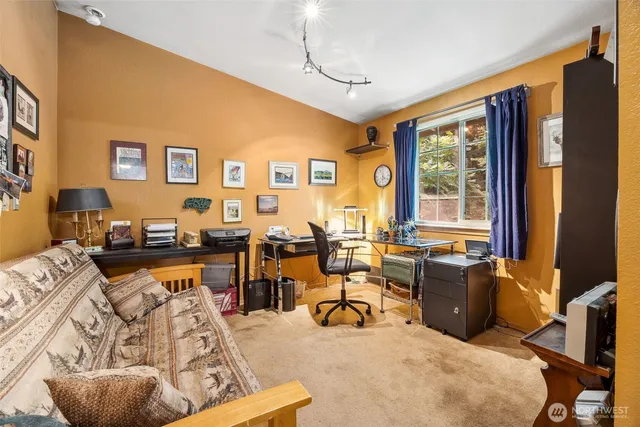 a living room with furniture window and wooden floor