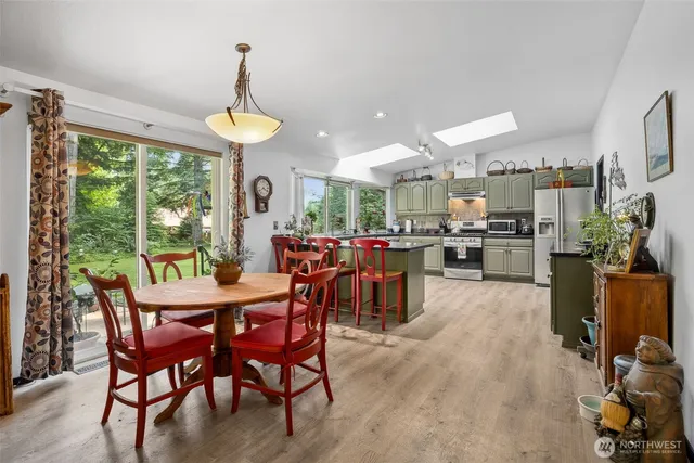 a view of a dining room with furniture window and outside view