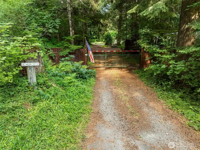 a view of a backyard with sitting area