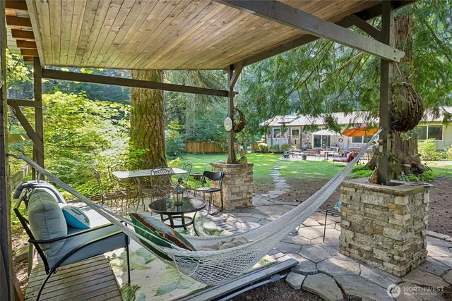 a sitting area with furniture and garden view