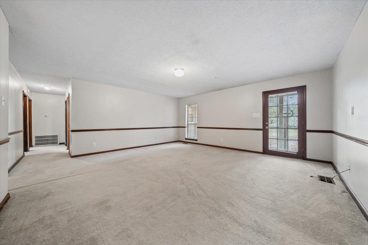 10060 Rosemark Road Atoka, TN 38004 - Photo 11 of 26 a view of an empty room with a window