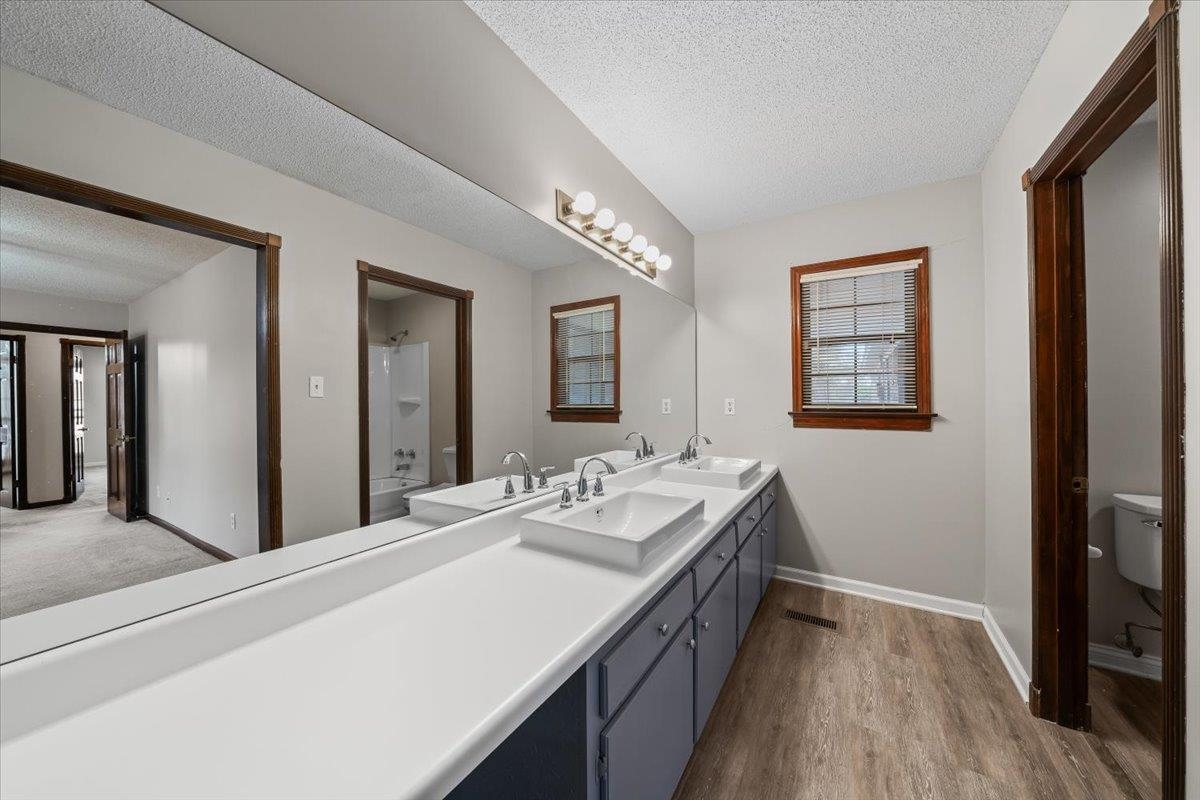 10060 Rosemark Road Atoka, TN 38004 - Photo 15 of 26 a spacious bathroom with a double vanity sink and a mirror