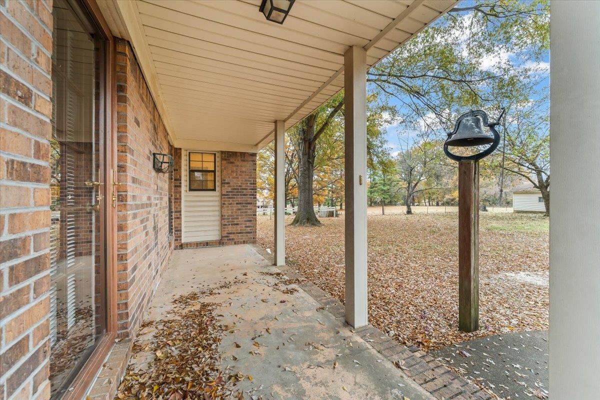 10060 Rosemark Road Atoka, TN 38004 - Photo 20 of 26 a porch with a bench