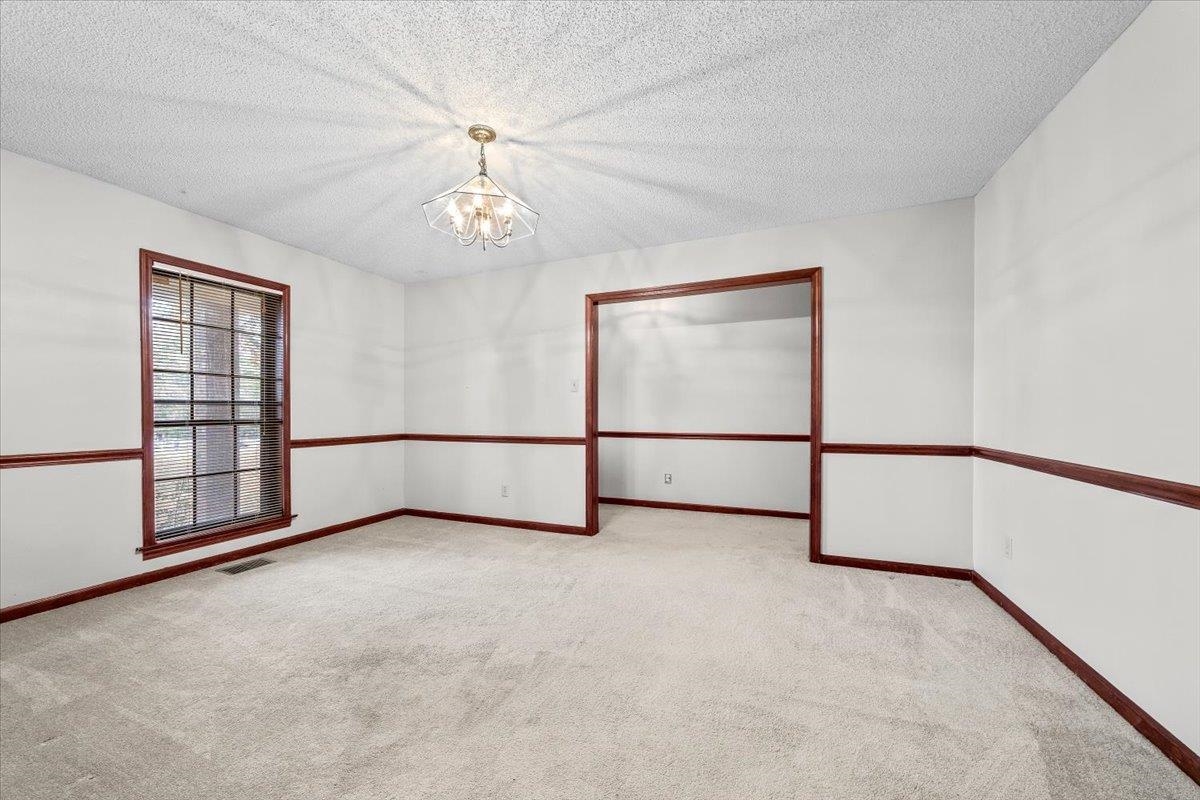 10060 Rosemark Road Atoka, TN 38004 - Photo 8 of 26 an empty room with windows and fan