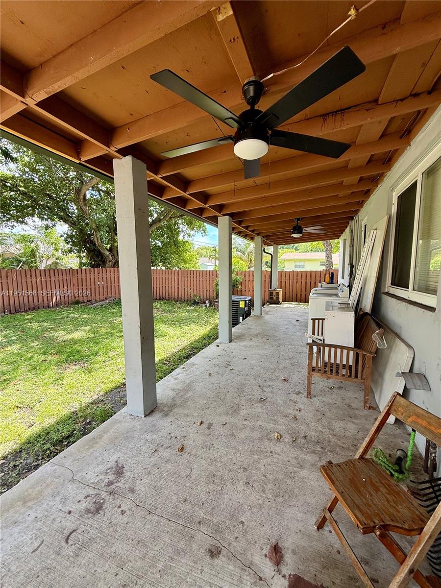 1085 Northwest 48th Street Miami, FL 33127 - Photo 12 of 14 washer and dryer is located outside on covered deck