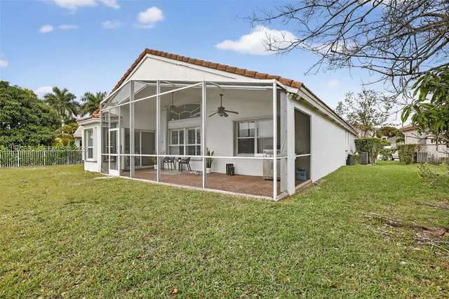 a view of swimming pool with a yard and lake view
