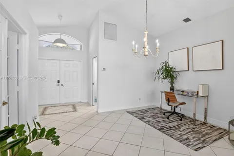 a view of a chandelier and entryway