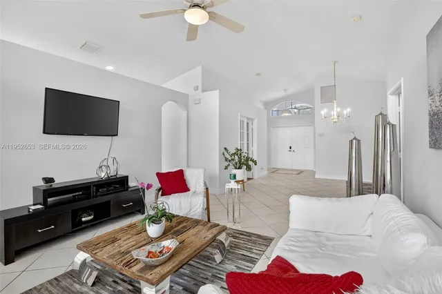 a living room with furniture and a flat screen tv