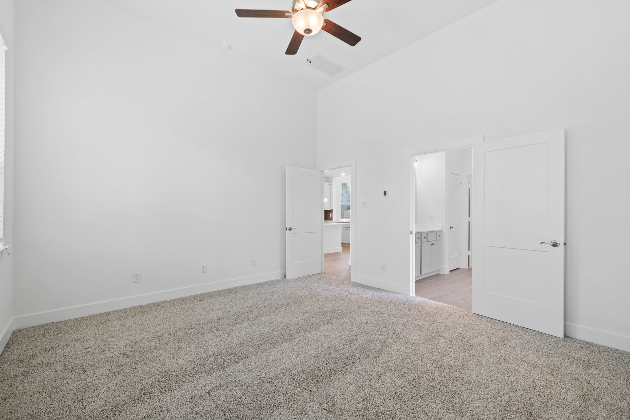 12846 Meadow Wind Way Conroe, TX 77302 - Photo 12 of 32 a view of a room with cabinet and a ceiling fan