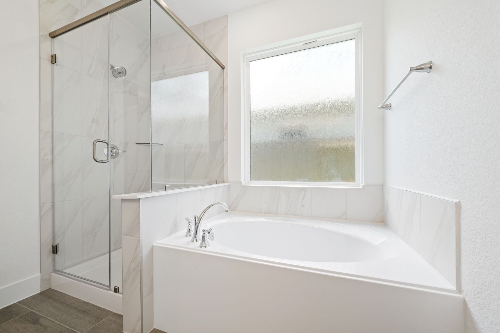 12846 Meadow Wind Way Conroe, TX 77302 - Photo 13 of 32 a white bath tub sitting next to a shower