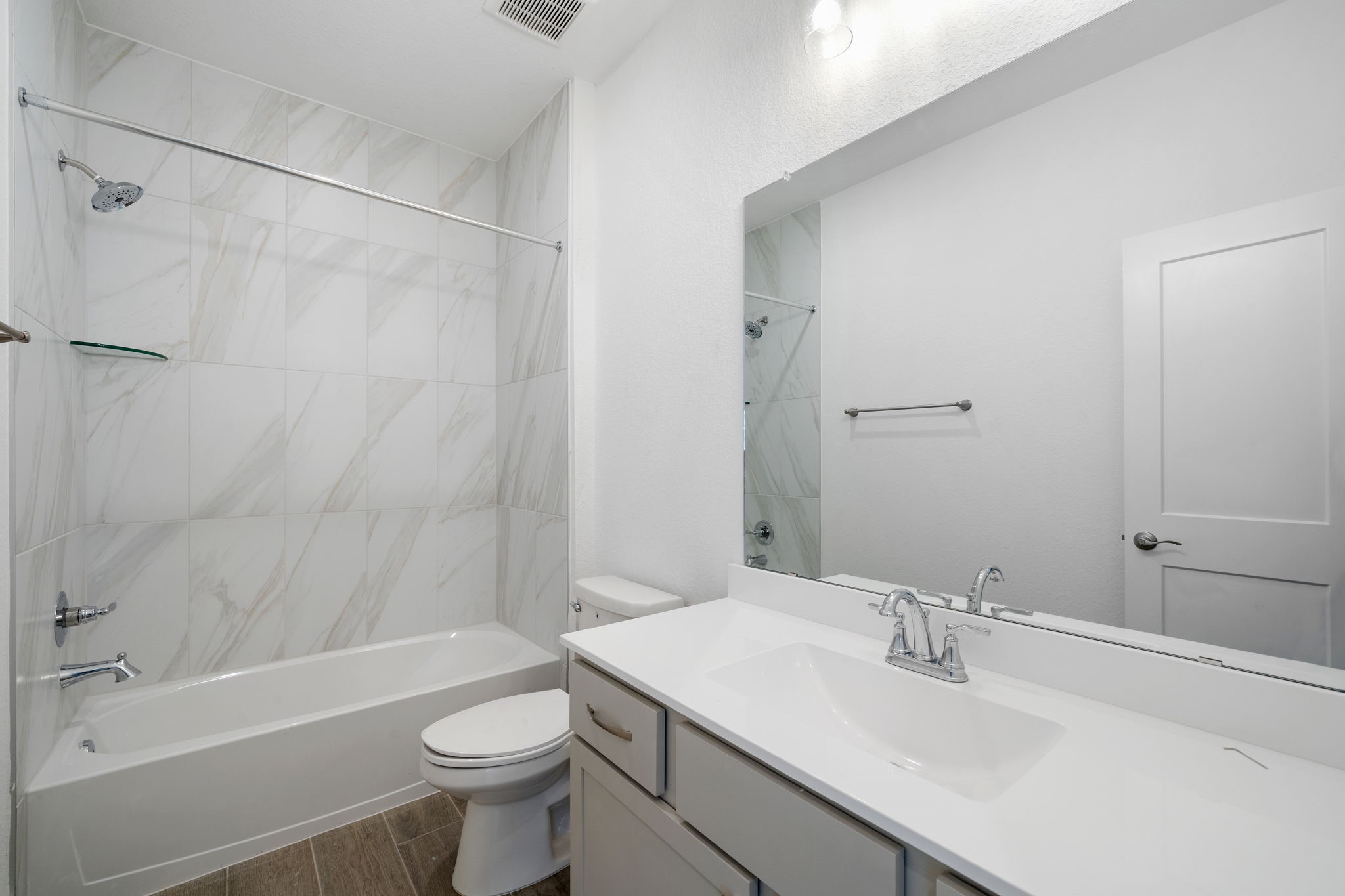 12846 Meadow Wind Way Conroe, TX 77302 - Photo 16 of 32 a bathroom with a sink a toilet and shower