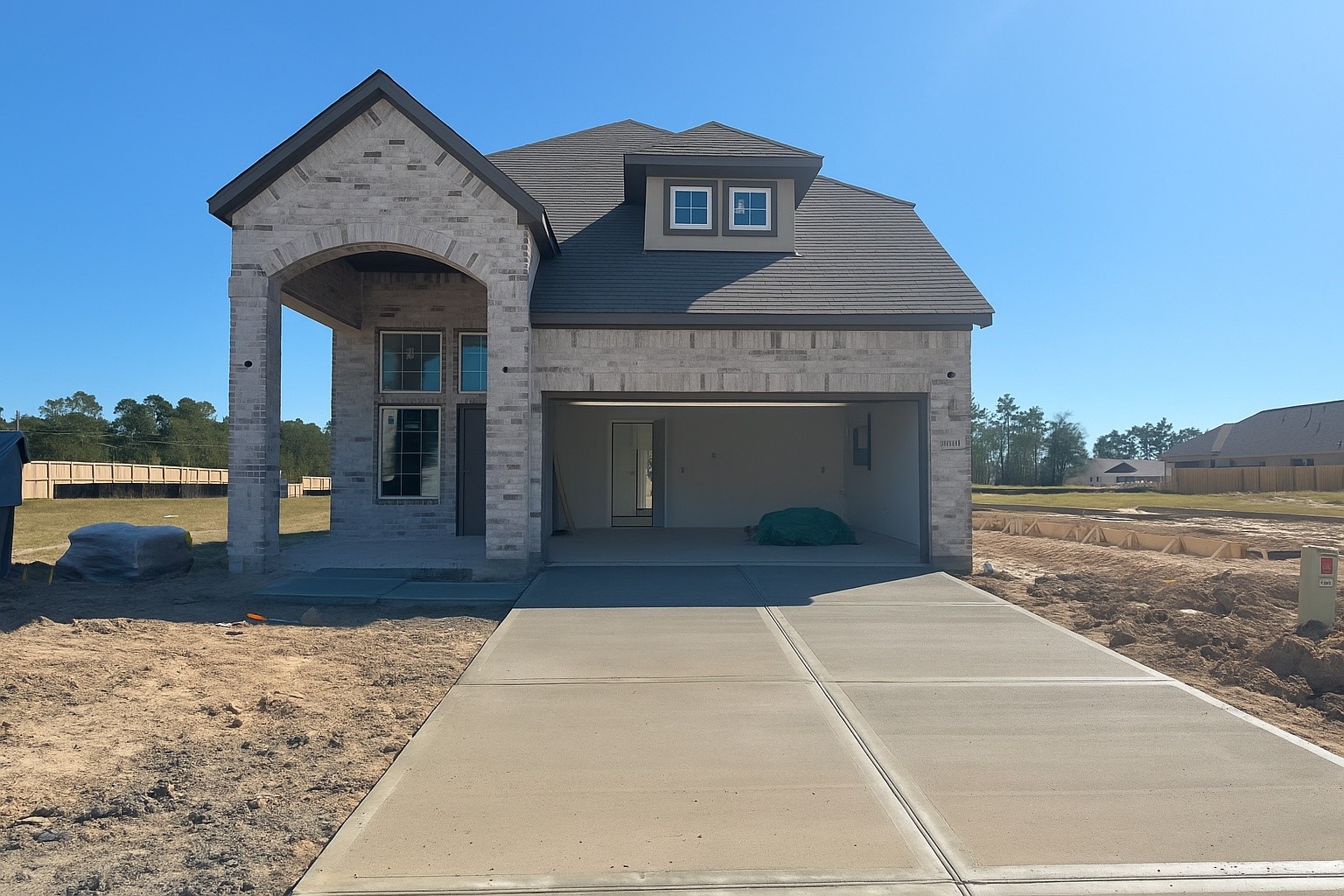 12846 Meadow Wind Way Conroe, TX 77302 - Photo 19 of 32 a front view of a house with garden
