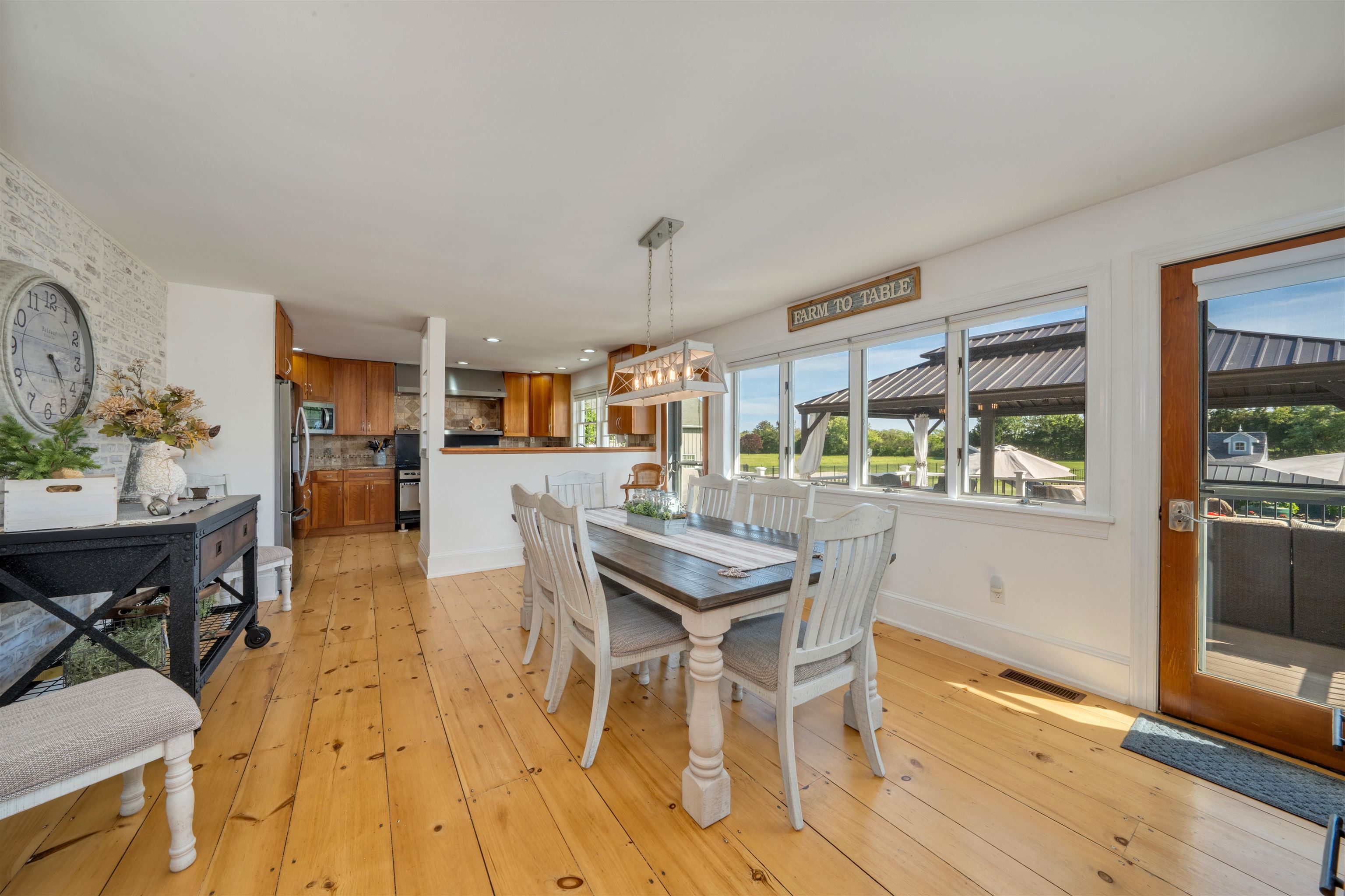 892 Weeks Landing Road Erma, NJ 08204 - Photo 15 of 50 a view of a dining room with furniture and wooden floor