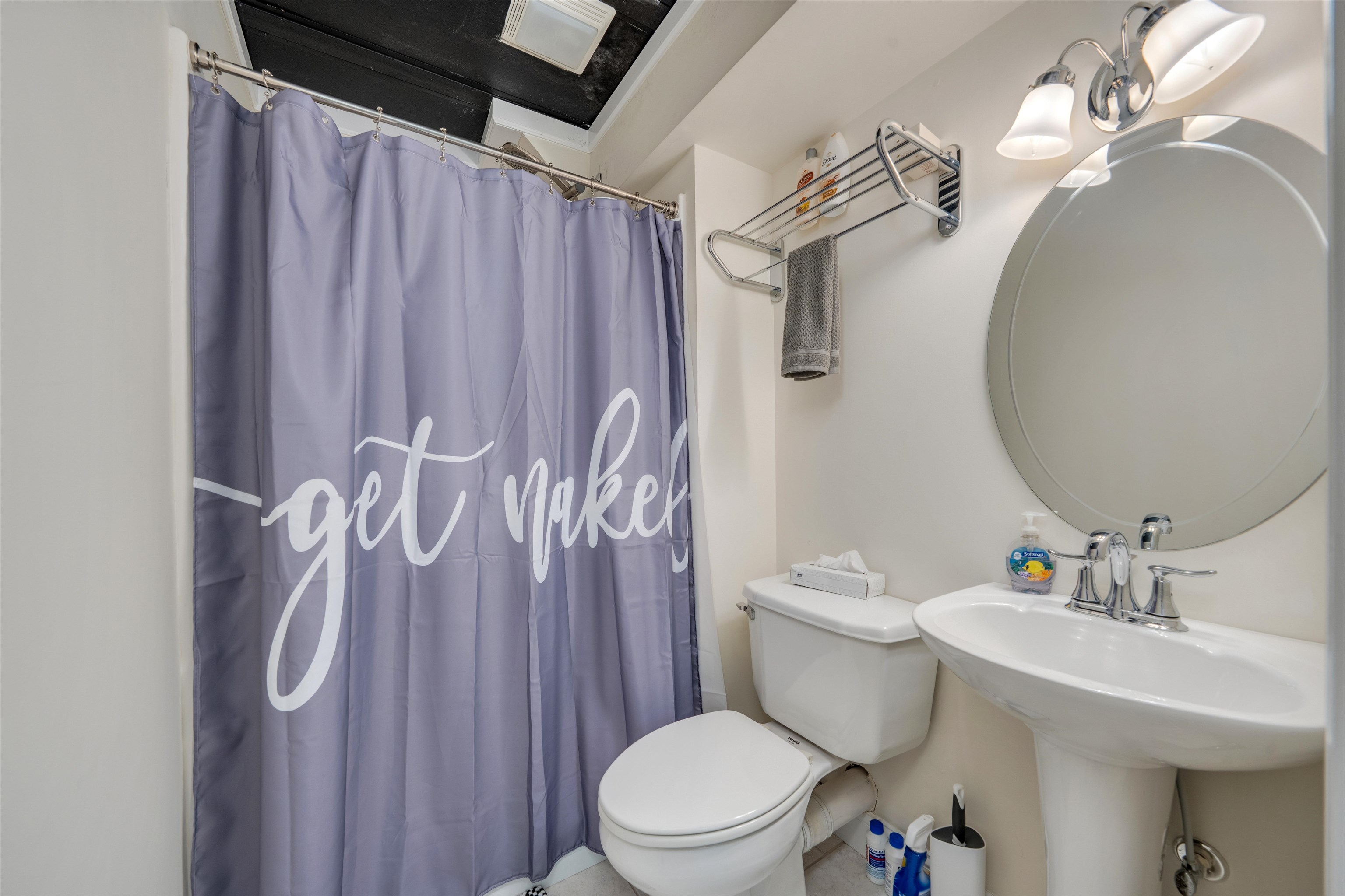 892 Weeks Landing Road Erma, NJ 08204 - Photo 42 of 50 a bathroom with a sink a toilet a mirror and shower curtain