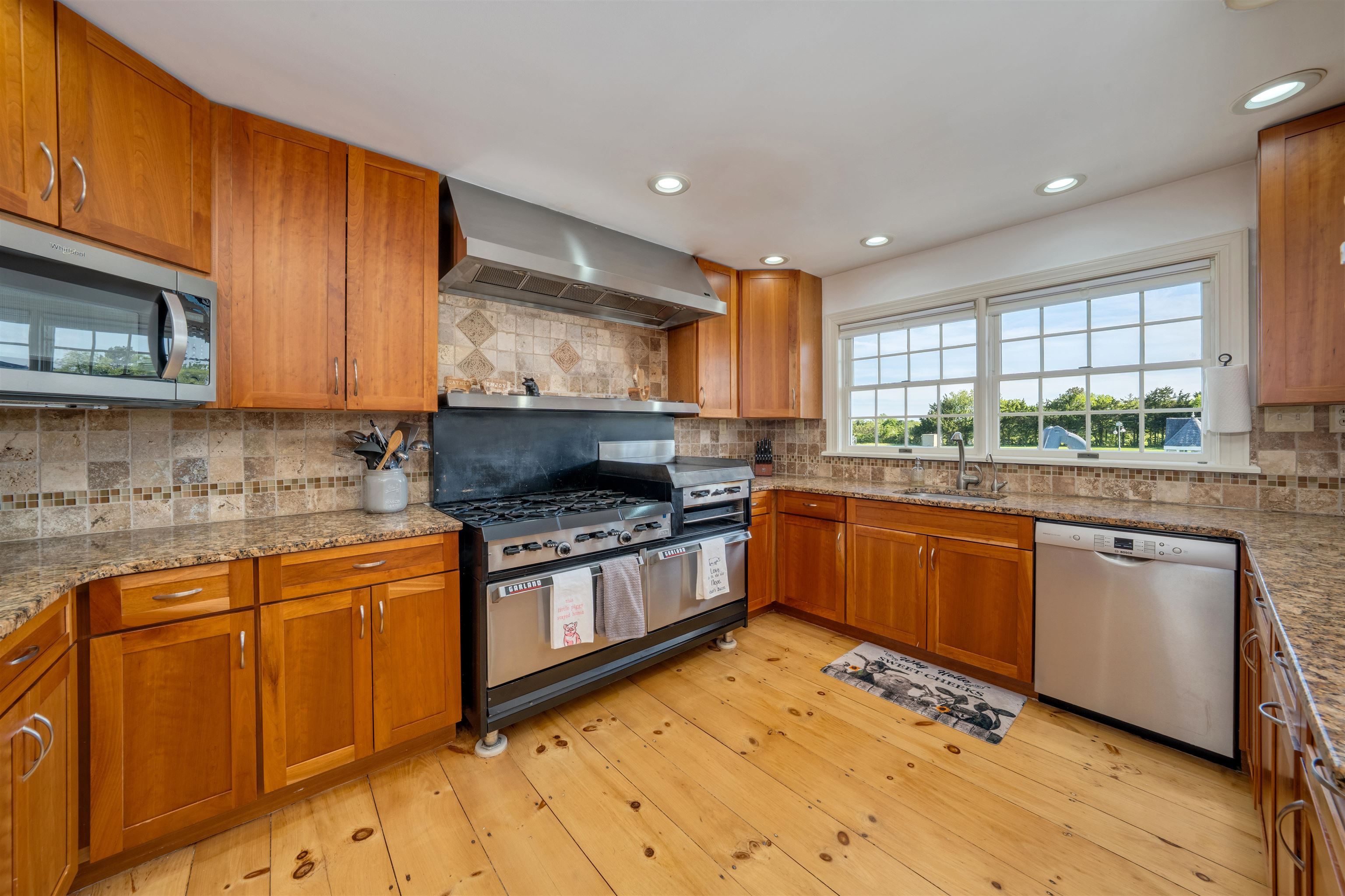 892 Weeks Landing Road Erma, NJ 08204 - Photo 8 of 50 a kitchen with stainless steel appliances granite countertop wooden cabinets sink and window