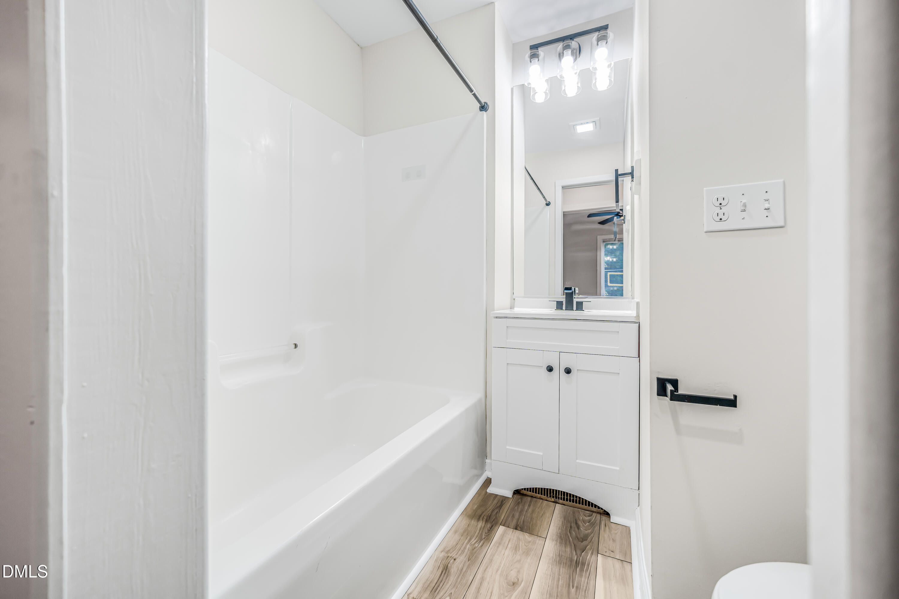 201 Howell Street, Unit 100A Chapel Hill, NC 27514 - Photo 13 of 22 a bathroom with a sink and a mirror