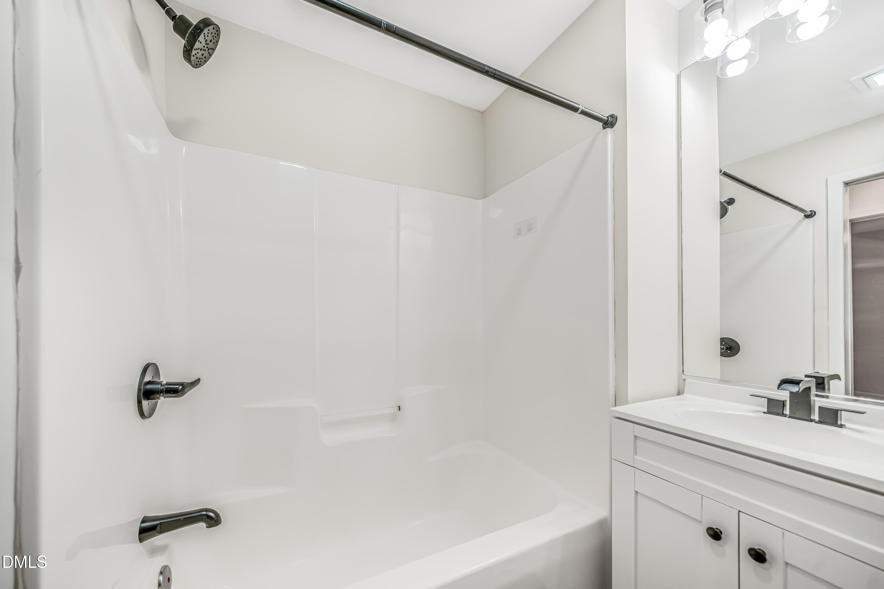 201 Howell Street, Unit 100A Chapel Hill, NC 27514 - Photo 14 of 22 a bathroom with a sink and a bathtub