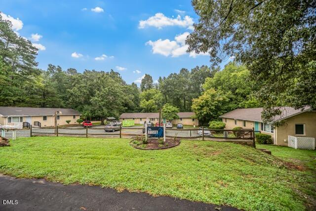201 Howell Street, Unit 100A Chapel Hill, NC 27514 - Photo 17 of 22 a view of a house with patio and a garden
