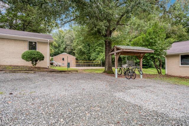 201 Howell Street, Unit 100A Chapel Hill, NC 27514 - Photo 18 of 22 a view of a house with backyard and sitting area