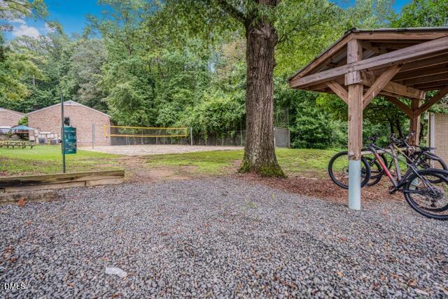 201 Howell Street, Unit 100A Chapel Hill, NC 27514 - Photo 20 of 22 a view of a house with backyard and trees