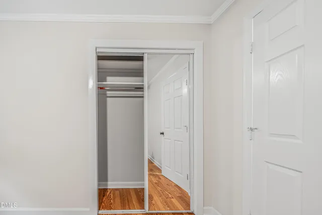 a view of walk in closet with white walls