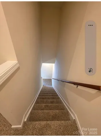 a large kitchen with stainless steel appliances a large counter top a stove and a wooden floors