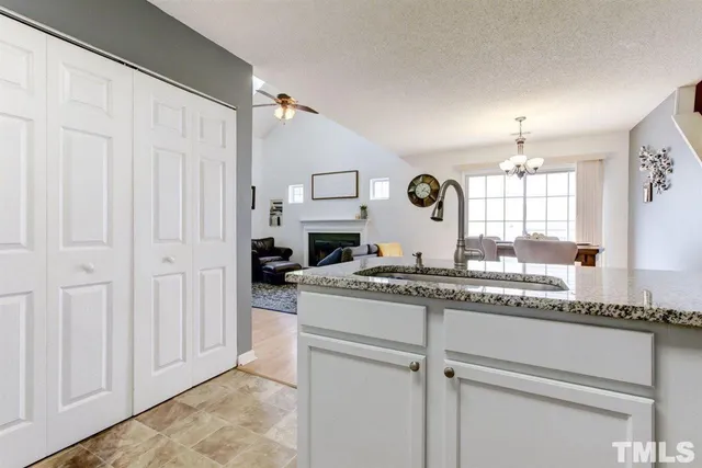 a bedroom with a bed furniture and a book shelf