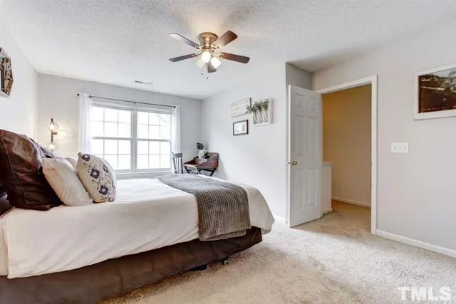 a living room with furniture and a book shelf