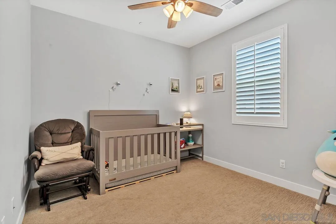 8869 Trailridge Avenue Santee, CA 92071 - Photo 29 of 48 a bedroom with furniture and a window