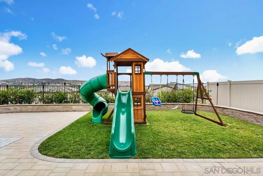 8869 Trailridge Avenue Santee, CA 92071 - Photo 32 of 48 a backyard of a house with table and chairs