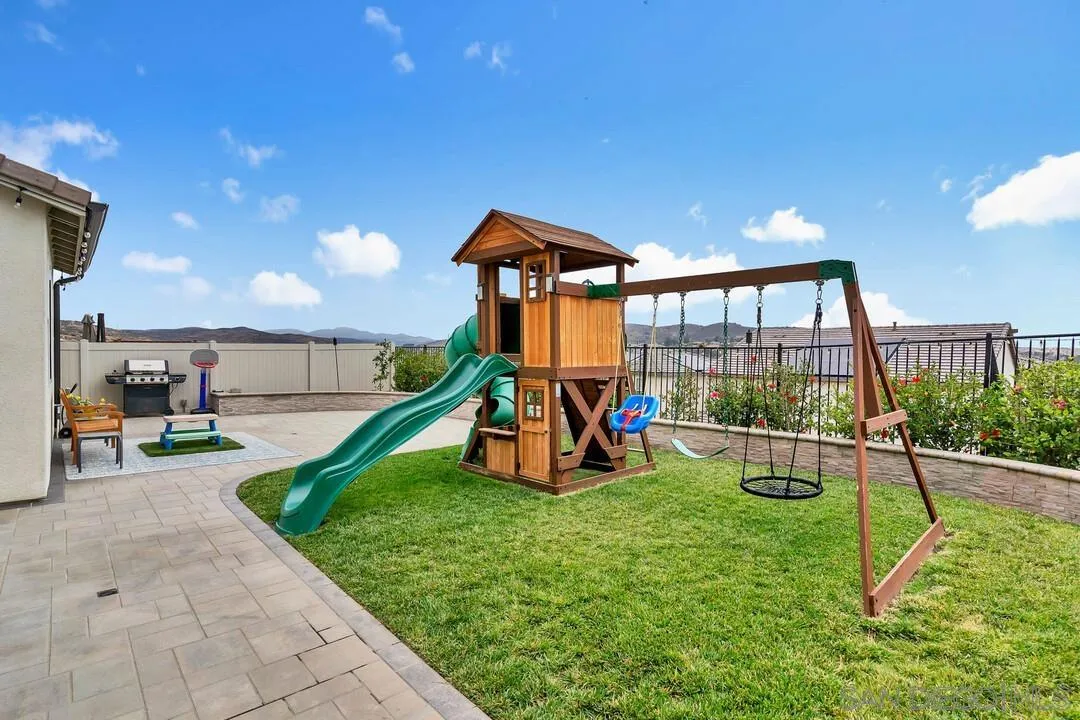 8869 Trailridge Avenue Santee, CA 92071 - Photo 33 of 48 a view of a backyard with swimming pool