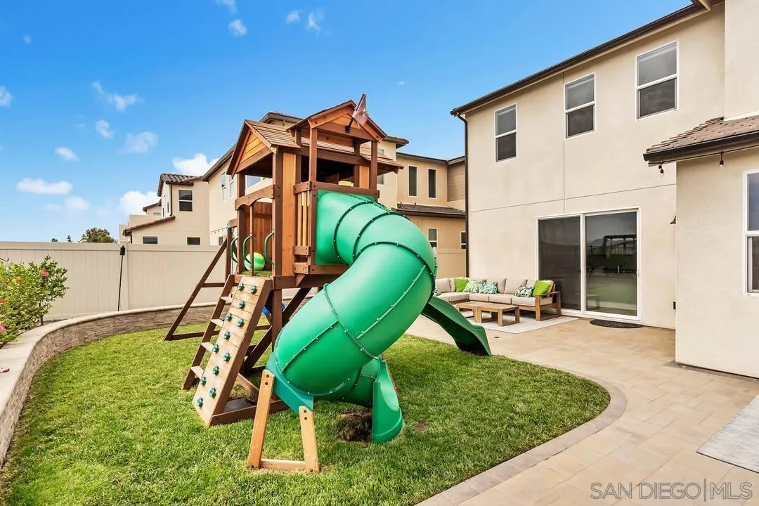 8869 Trailridge Avenue Santee, CA 92071 - Photo 36 of 48 a backyard of a house with seating space