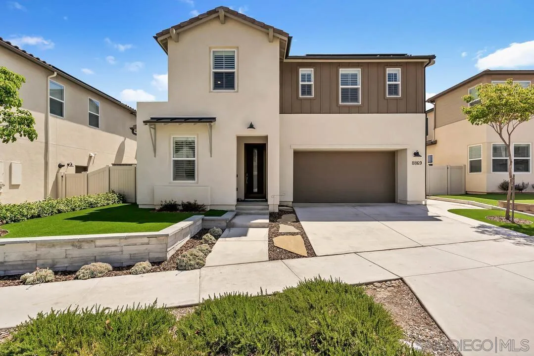 8869 Trailridge Avenue Santee, CA 92071 - Photo 38 of 48 a front view of a house with a yard and a garage