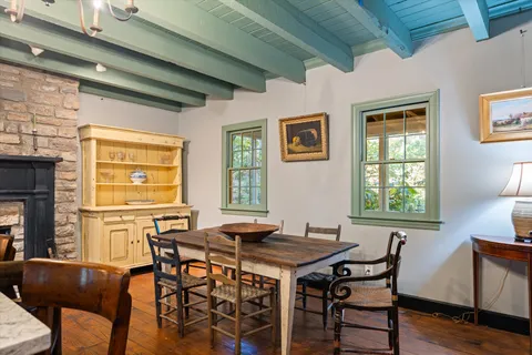 a view of a utility room with a fireplace and a window