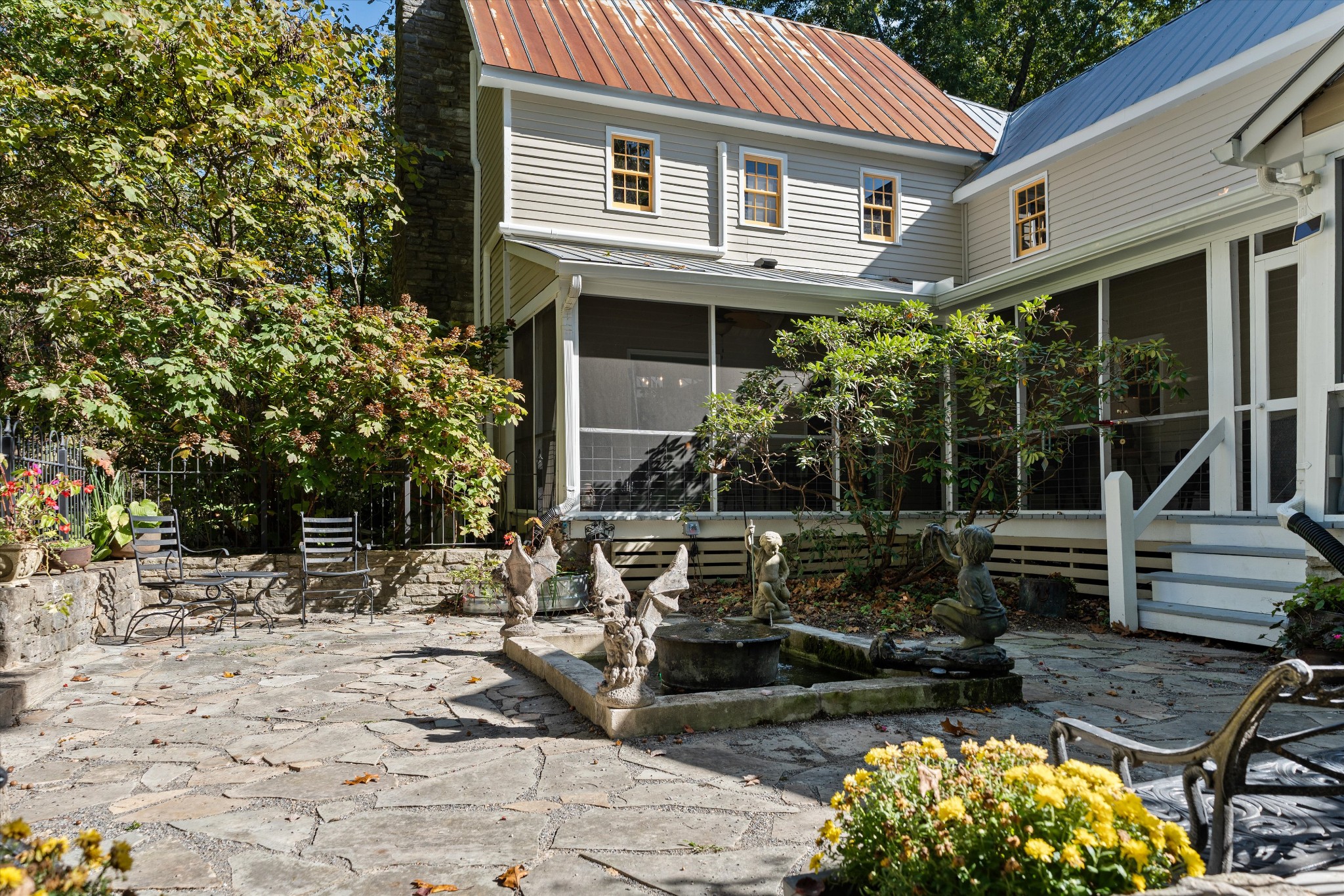 5180 Fire Tower Road Franklin, TN 37064 - Photo 56 of 98 a view of house with backyard outdoor seating and plants