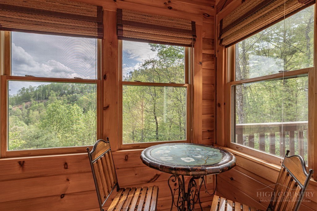 197 Woodby Ridge Road Vilas, NC 28692 - Photo 15 of 45 a view of a room with a table and chairs