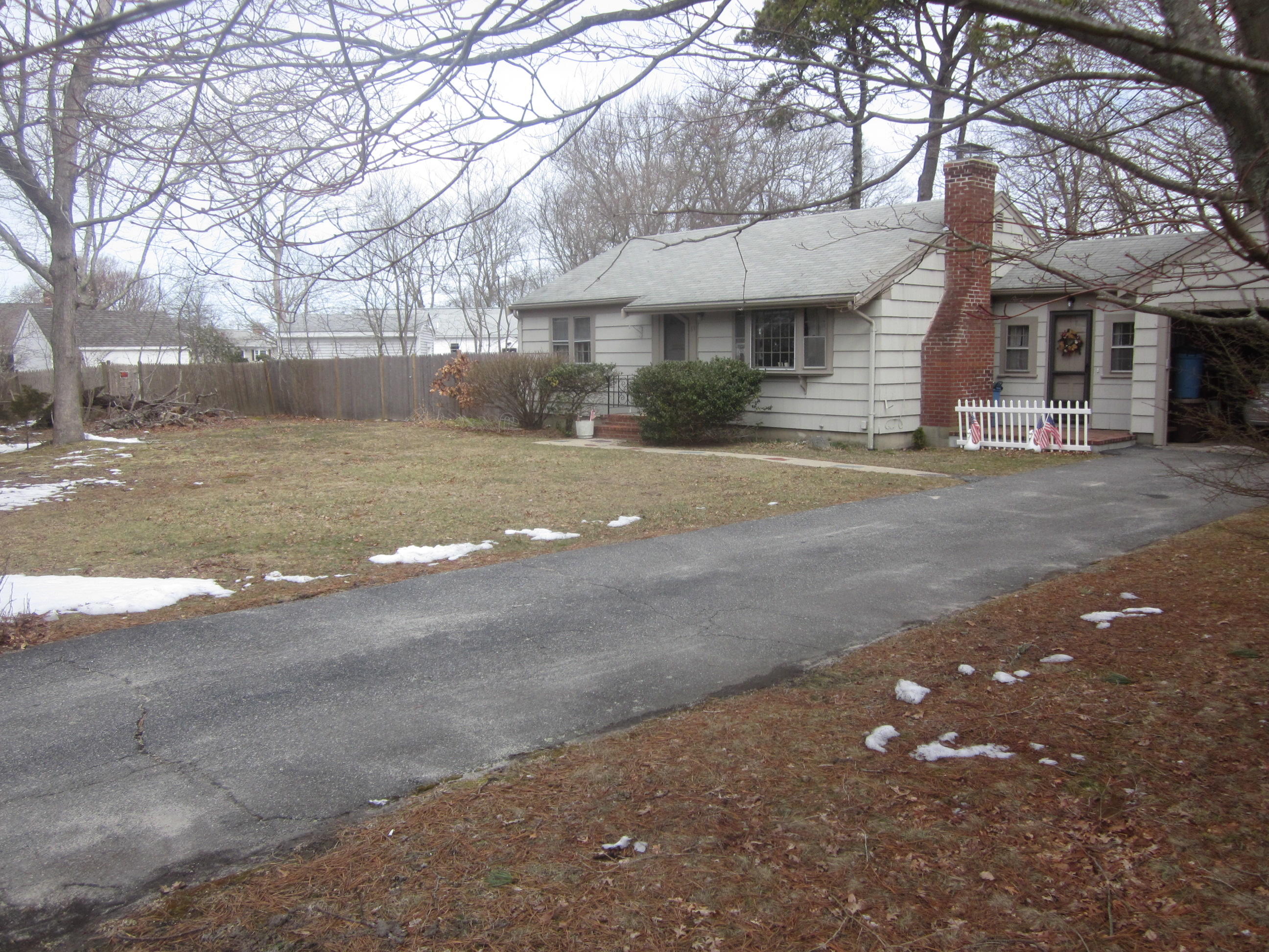 34 Franbill Road Hyannis, MA 02601 - Photo 2 of 14 a front view of a house with a road
