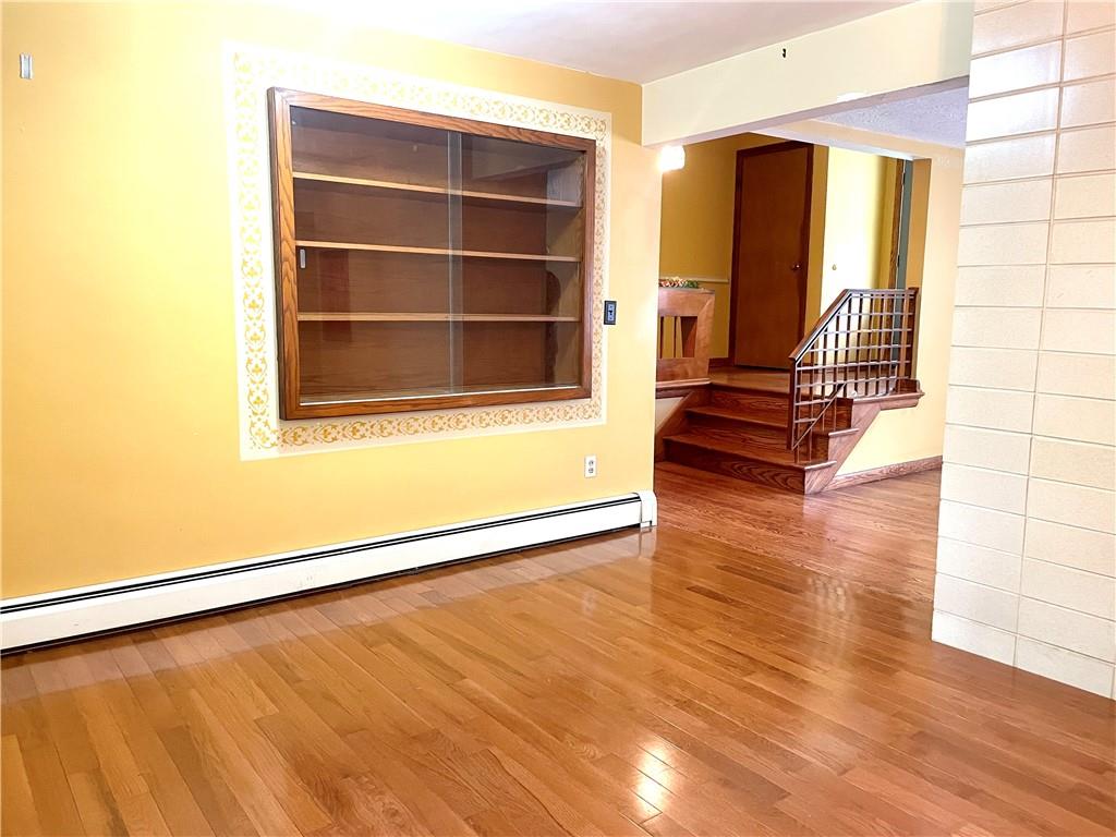 472 West Sunbury Road Butler, PA 16001 - Photo 17 of 39 a view of an empty room with wooden floor and a window
