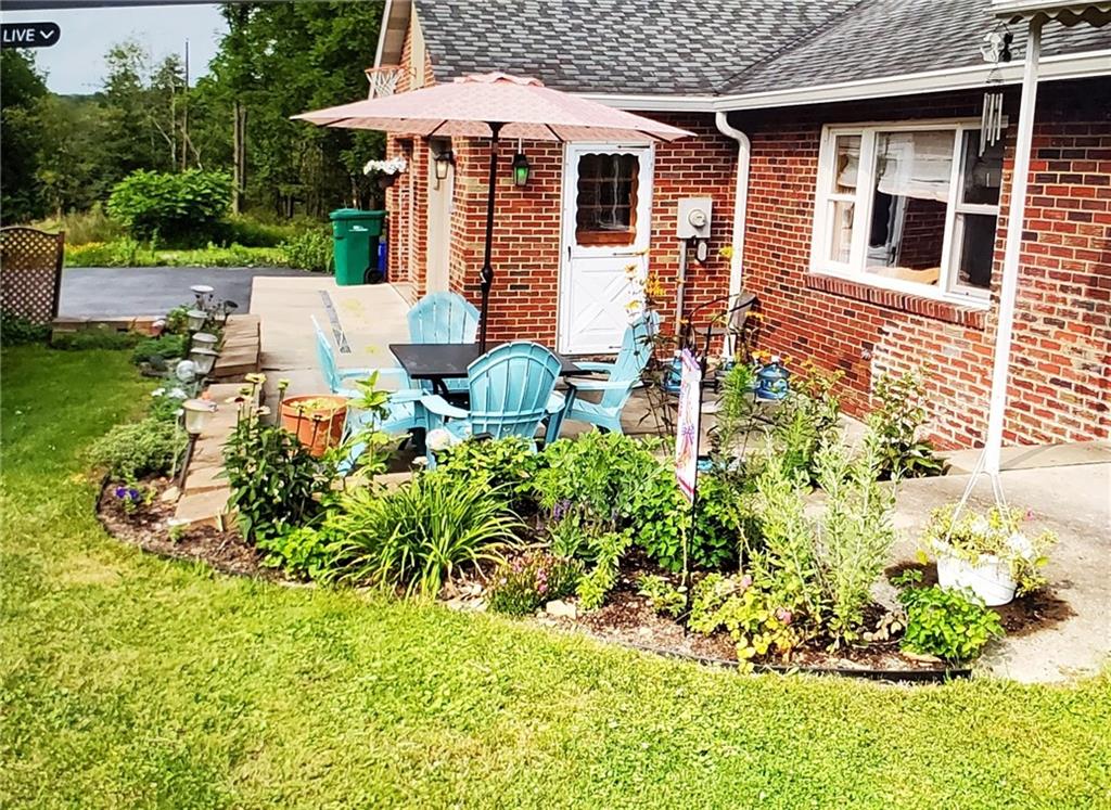 472 West Sunbury Road Butler, PA 16001 - Photo 2 of 39 a view of a backyard with plants and patio