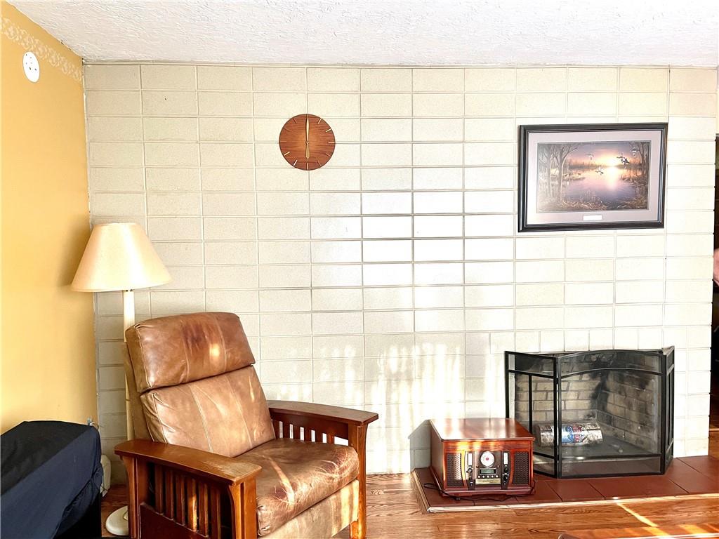 472 West Sunbury Road Butler, PA 16001 - Photo 5 of 39 a living room with furniture and a fireplace