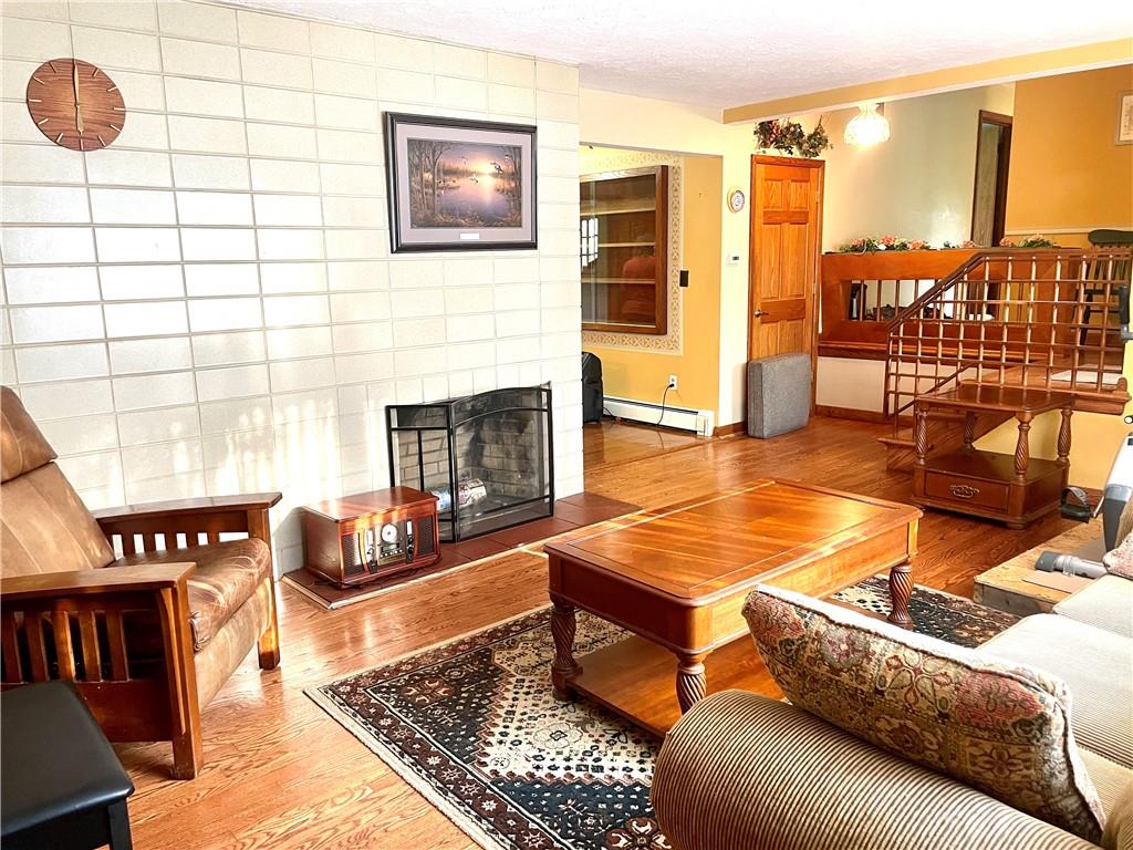 472 West Sunbury Road Butler, PA 16001 - Photo 6 of 39 a living room with furniture and a fireplace