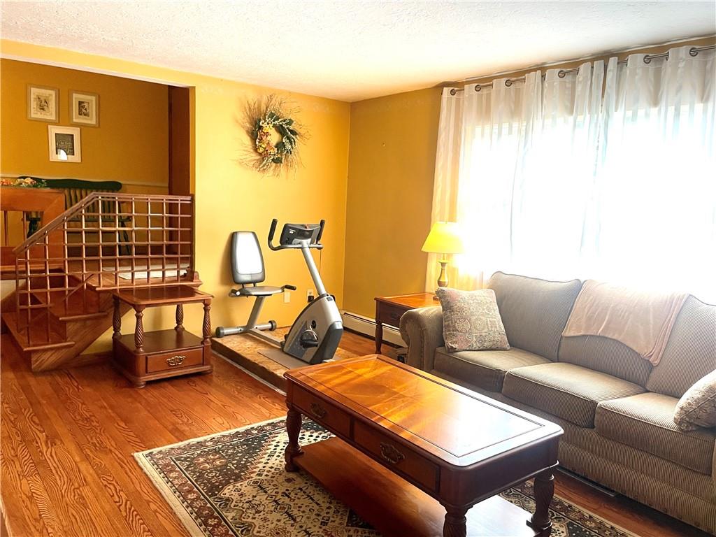 472 West Sunbury Road Butler, PA 16001 - Photo 7 of 39 a living room with furniture a rug and a window