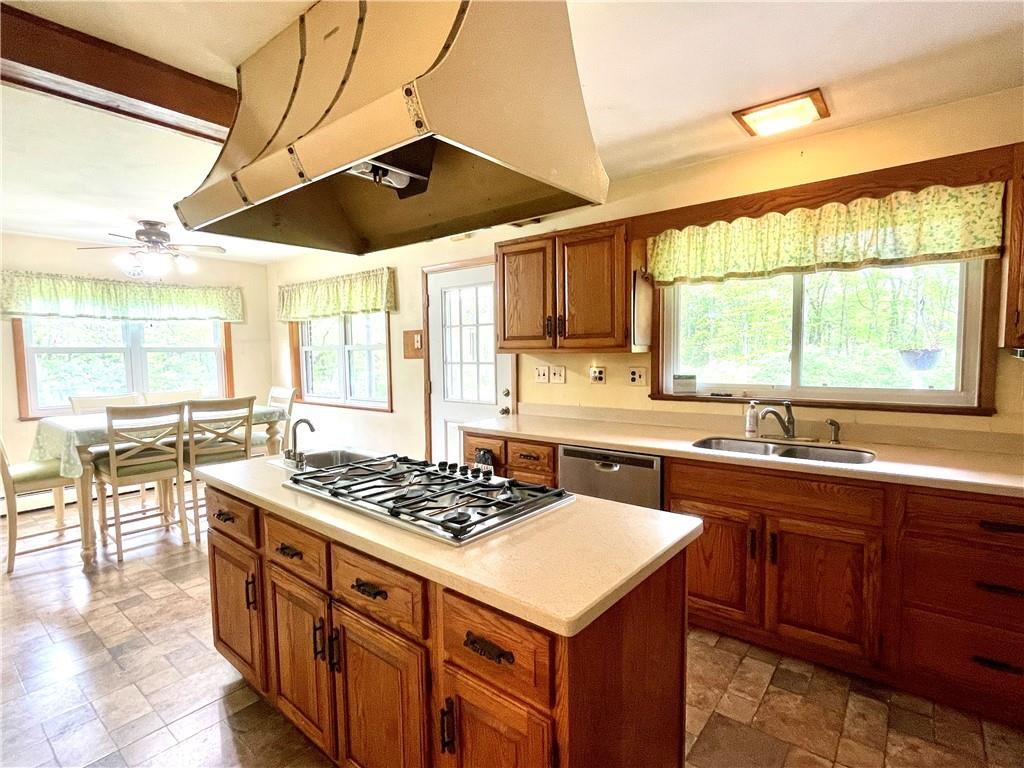472 West Sunbury Road Butler, PA 16001 - Photo 8 of 39 a kitchen with a stove a sink a window and dining table
